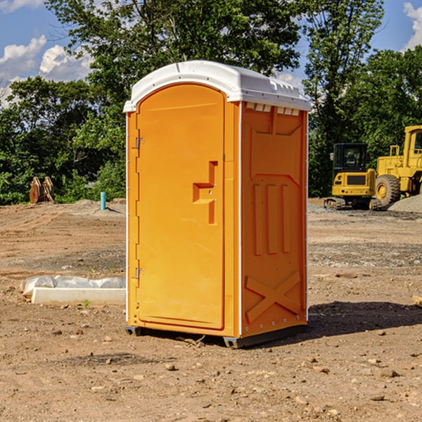 what is the cost difference between standard and deluxe portable restroom rentals in Emmett